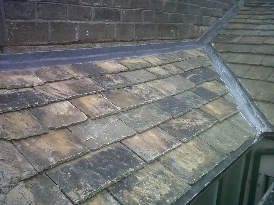 Lead-lined valley running between two pitches of a stone slate roof